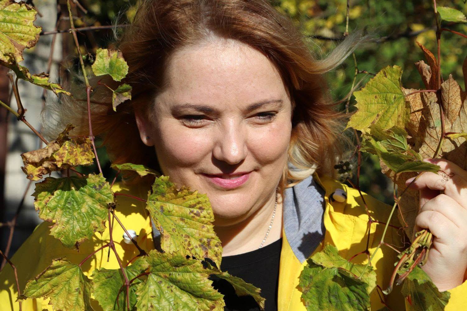 close up of woman amidst plants