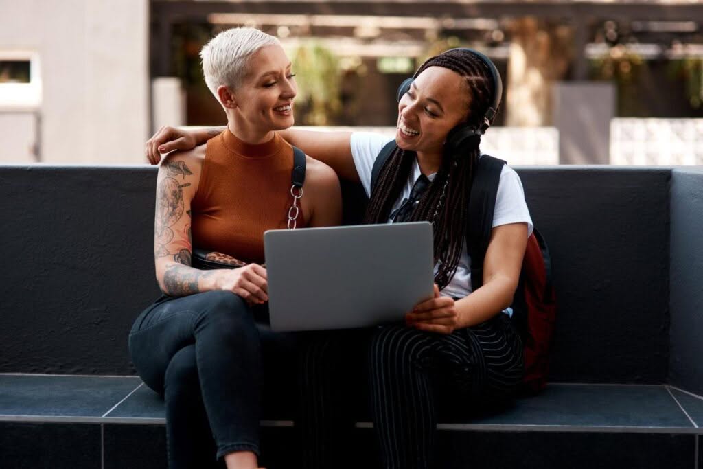 laptop couple and women in city